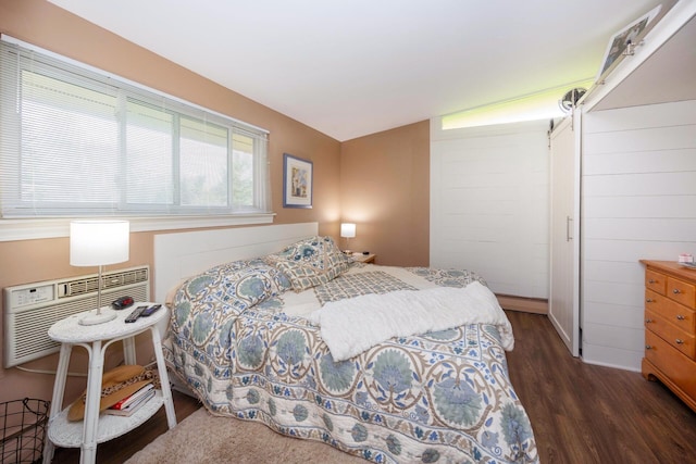 5009 John Holmes Rd, Ann Arbor, MI 48103 - bedroom with dark wood-style flooring, a baseboard radiator, and an AC wall unit