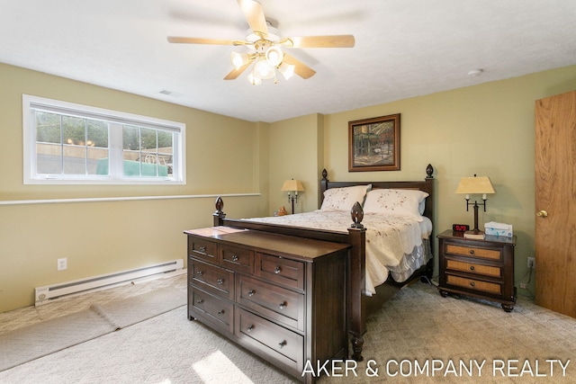 bedroom with ceiling fan, a baseboard heating unit, light carpet, and visible vents