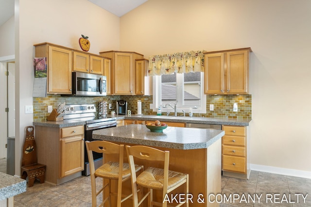 kitchen with stainless steel appliances, high vaulted ceiling, decorative backsplash, and a sink