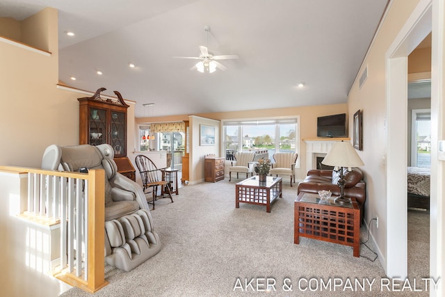 living area featuring carpet flooring, a ceiling fan, recessed lighting, and lofted ceiling