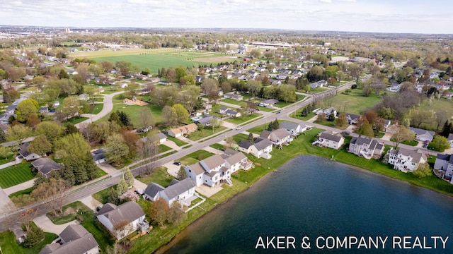 bird's eye view with a water view and a residential view
