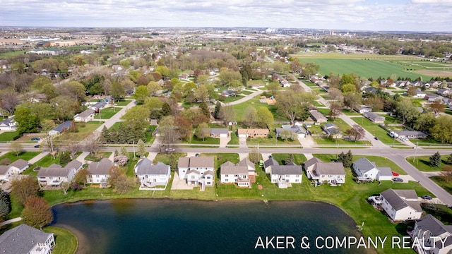 aerial view featuring a residential view and a water view