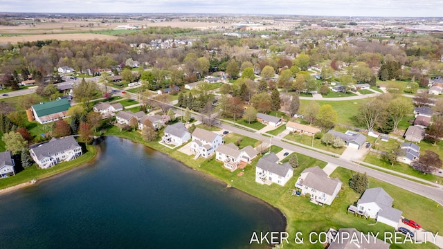 birds eye view of property with a residential view and a water view