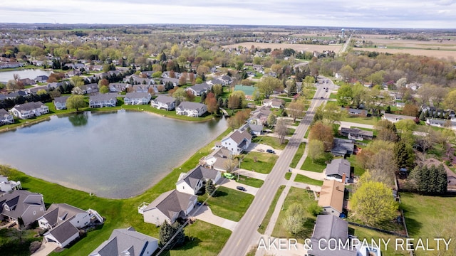 birds eye view of property featuring a residential view and a water view