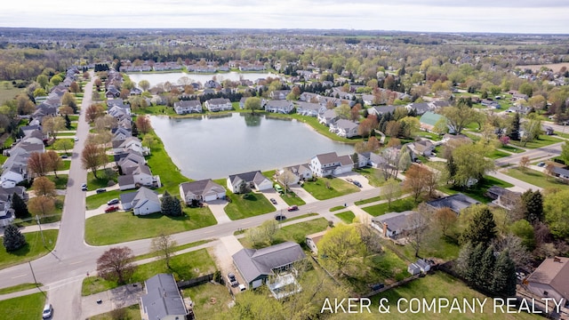 birds eye view of property with a residential view and a water view