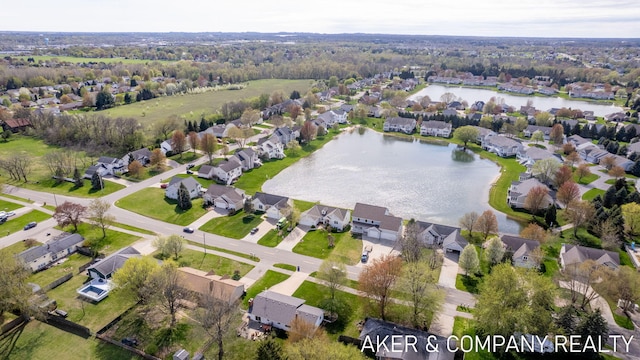 birds eye view of property featuring a water view and a residential view