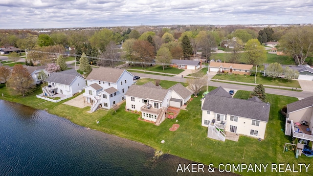 bird's eye view with a water view and a residential view