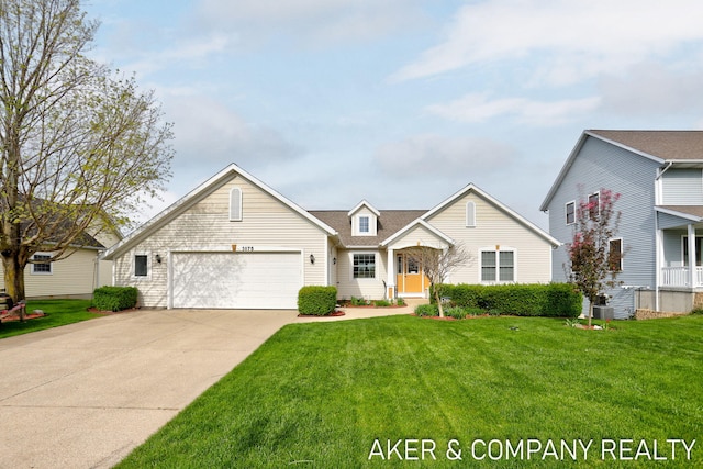 traditional home featuring an attached garage, a front lawn, central AC, and concrete driveway