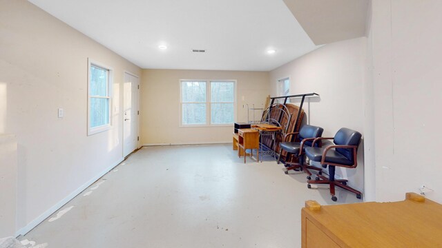 sitting room with visible vents, recessed lighting, concrete flooring, and baseboards
