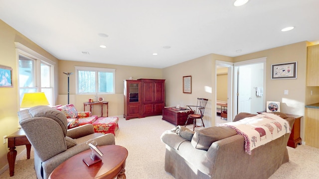 living room featuring recessed lighting and light colored carpet