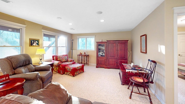 living area featuring recessed lighting, carpet flooring, baseboards, and visible vents