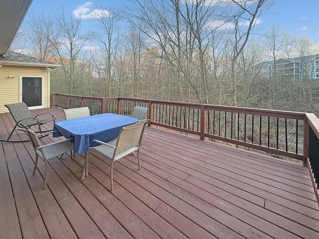 deck featuring outdoor dining area