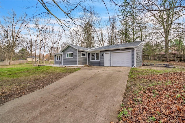 10985 E Cd Ave, Richland, MI 49083 - single story home with fence, concrete driveway, a front lawn, and a garage