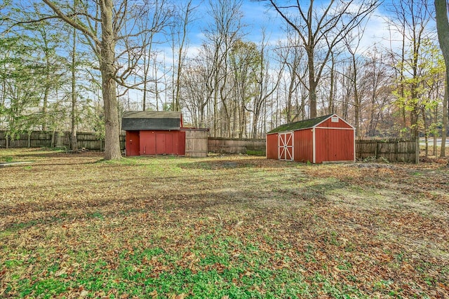 10985 E Cd Ave, Richland, MI 49083 - view of yard featuring an outdoor structure, a storage shed, and a fenced backyard