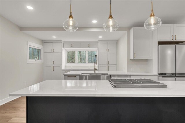 10985 E Cd Ave, Richland, MI 49083 - kitchen featuring recessed lighting, a sink, cooktop, pendant lighting, and freestanding refrigerator