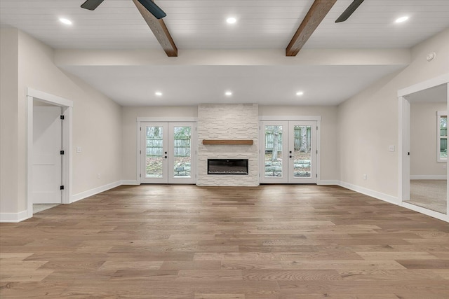 10985 E Cd Ave, Richland, MI 49083 - unfurnished living room featuring wood finished floors, ceiling fan, beamed ceiling, and french doors