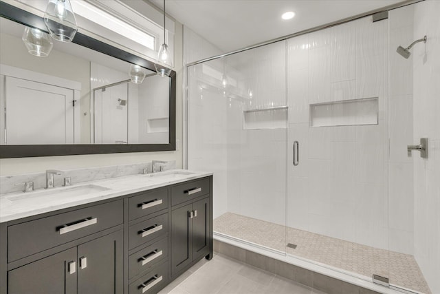 10985 E Cd Ave, Richland, MI 49083 - bathroom with tile patterned floors, a shower stall, double vanity, and a sink