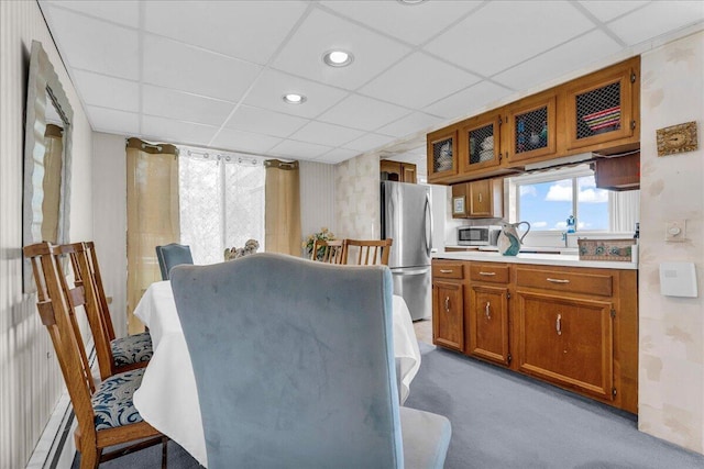 7226 Lakeview Dr, Lexington, MI 48450 - dining area with light carpet, baseboard heating, a paneled ceiling, and recessed lighting