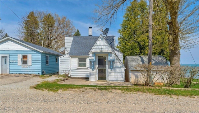 7226 Lakeview Dr, Lexington, MI 48450 - view of front facade featuring a chimney
