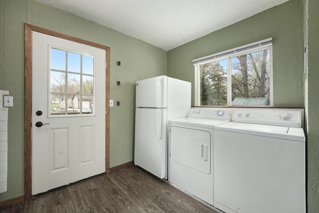 laundry room with baseboards, laundry area, dark wood-style flooring, and washer and dryer