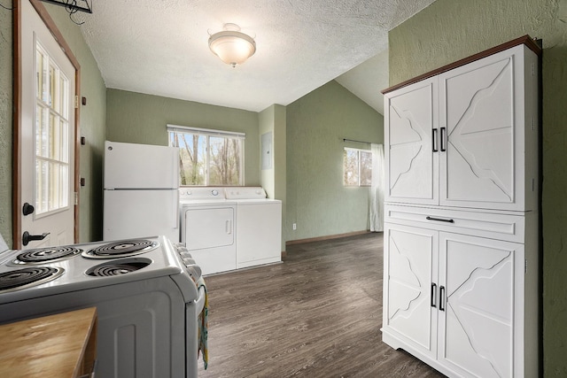 kitchen with washer / clothes dryer, a textured ceiling, freestanding refrigerator, and electric range oven