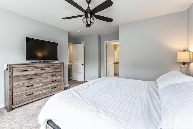 bedroom with carpet floors, baseboards, and visible vents