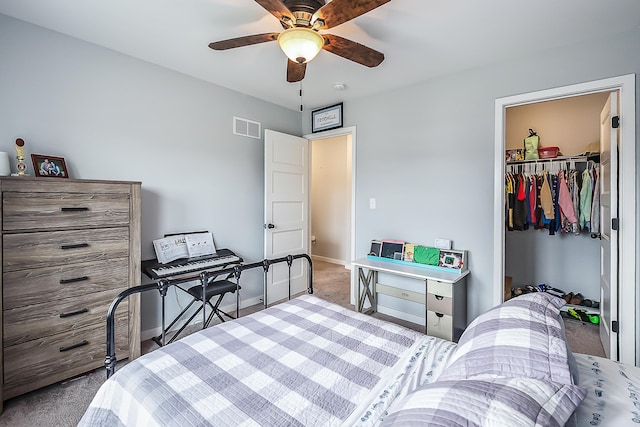 bedroom featuring visible vents, a closet, baseboards, ceiling fan, and carpet