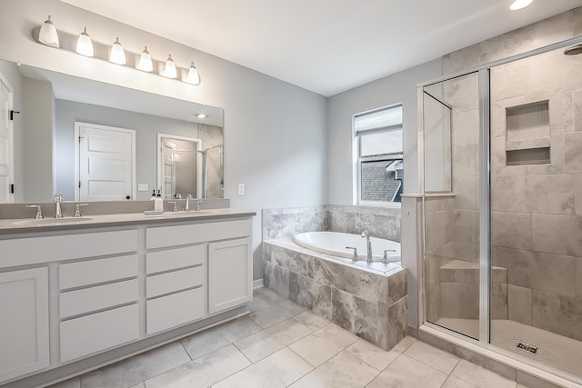 full bathroom with a garden tub, a sink, double vanity, and a shower stall