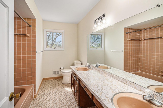 2038 S 7th St, Ann Arbor, MI 48103 - full bath with toilet, visible vents, a wealth of natural light, and a sink
