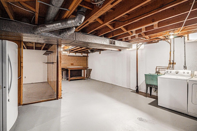2038 S 7th St, Ann Arbor, MI 48103 - unfinished basement featuring a sink, refrigerator, independent washer and dryer, and visible vents