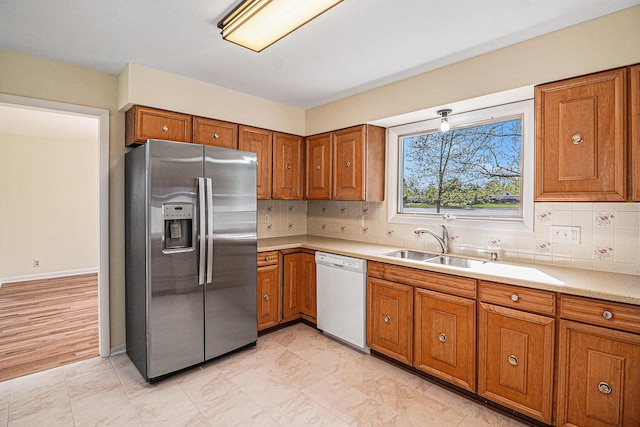 2038 S 7th St, Ann Arbor, MI 48103 - kitchen featuring white dishwasher, stainless steel fridge with ice dispenser, brown cabinets, and light countertops