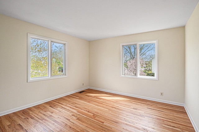 2038 S 7th St, Ann Arbor, MI 48103 - empty room with baseboards and light wood-style flooring