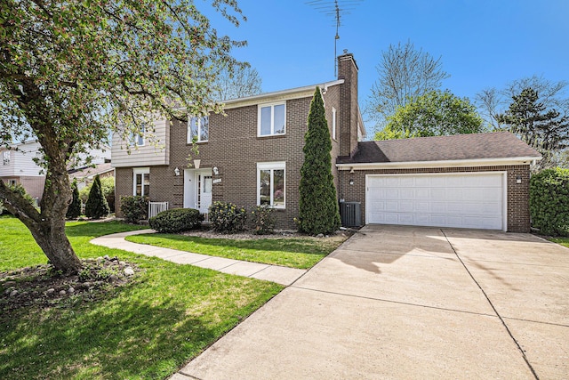 2038 S 7th St, Ann Arbor, MI 48103 - colonial inspired home featuring a front yard, concrete driveway, central AC, and brick siding