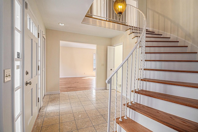 2038 S 7th St, Ann Arbor, MI 48103 - tiled foyer entrance with stairway, baseboards, and recessed lighting