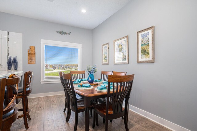 3080 Silver Fir Ct, Holland, MI 49424 - dining space featuring baseboards, wood finished floors, and recessed lighting