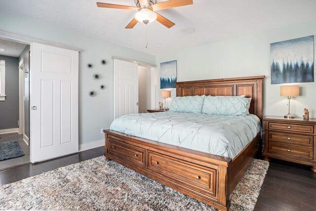 3080 Silver Fir Ct, Holland, MI 49424 - bedroom featuring baseboards, dark wood finished floors, and ceiling fan
