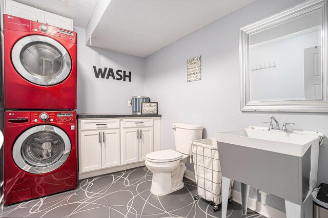 3080 Silver Fir Ct, Holland, MI 49424 - bathroom with stacked washer / drying machine, toilet, and vanity