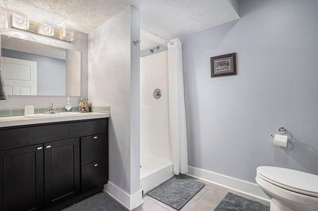 3080 Silver Fir Ct, Holland, MI 49424 - full bath featuring a shower with curtain, toilet, baseboards, tile patterned flooring, and vanity
