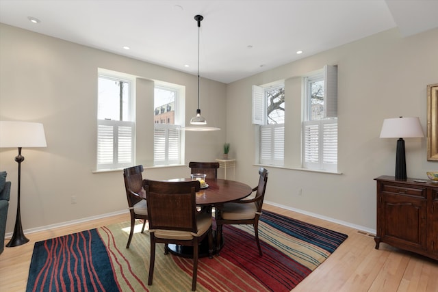223 E Ann St Unit 1, Ann Arbor, MI 48104 - dining room featuring plenty of natural light, baseboards, visible vents, and light wood-type flooring