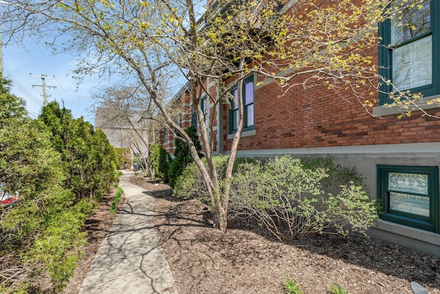 223 E Ann St Unit 1, Ann Arbor, MI 48104 - view of property exterior featuring brick siding