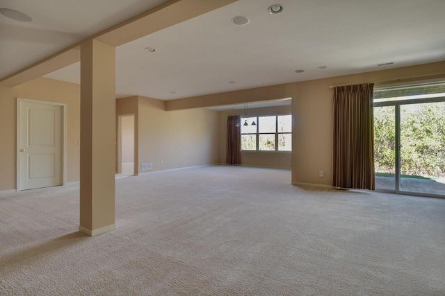 8660 Oakland Hills Cir, Portage, MI 49024 - unfurnished living room featuring baseboards, light carpet, and recessed lighting