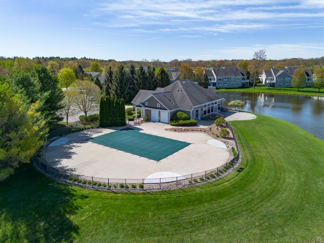 8660 Oakland Hills Cir, Portage, MI 49024 - view of pool featuring fence, a water view, and a lawn