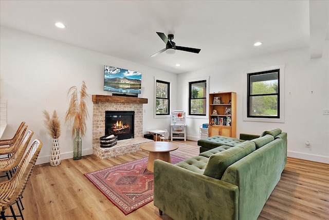 12950 Flynn Rd, Sawyer, MI 49125 - living room with a ceiling fan, baseboards, wood finished floors, a brick fireplace, and recessed lighting