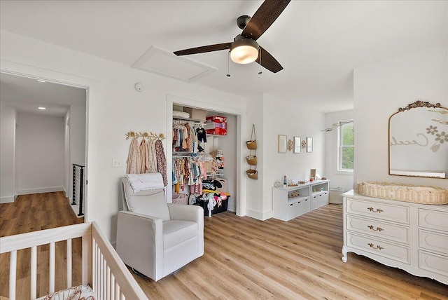 12950 Flynn Rd, Sawyer, MI 49125 - bedroom with light wood finished floors, a closet, a ceiling fan, and baseboards