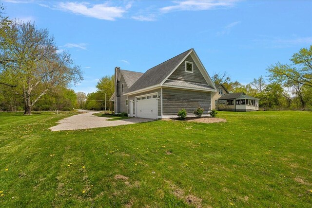 12950 Flynn Rd, Sawyer, MI 49125 - view of property exterior with driveway, a lawn, and a garage