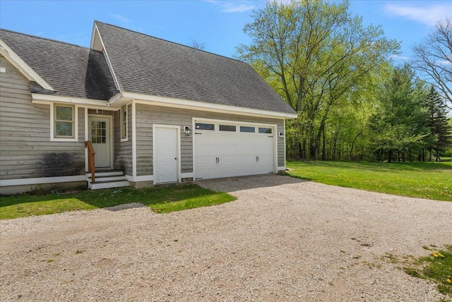 12950 Flynn Rd, Sawyer, MI 49125 - view of front of home with dirt driveway, roof with shingles, a garage, and a front yard