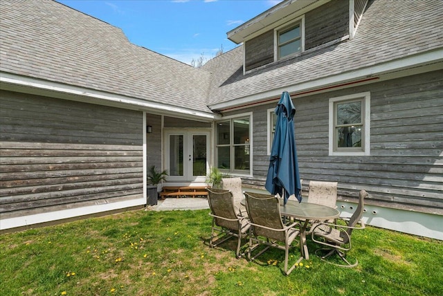 12950 Flynn Rd, Sawyer, MI 49125 - rear view of property featuring french doors, a shingled roof, and a lawn