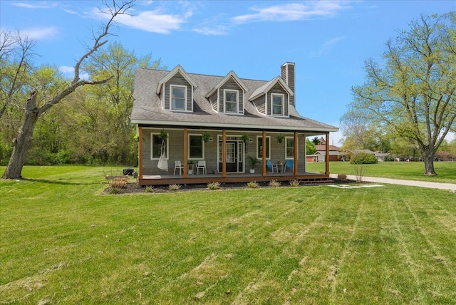 12950 Flynn Rd, Sawyer, MI 49125 - view of front of property featuring covered porch, a chimney, and a front lawn