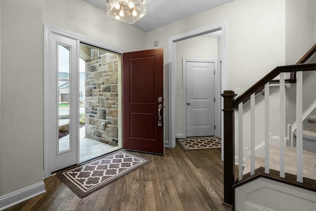 3100 Millbury Ln, Ann Arbor, MI 48105 - entryway featuring dark wood-type flooring, stairway, and a chandelier