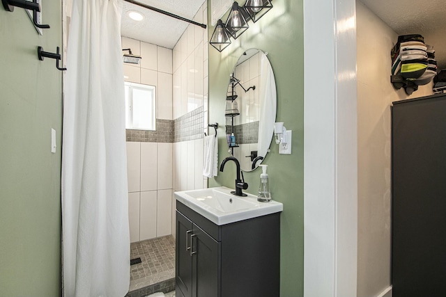 1146 Hall St SE, Grand Rapids, MI 49507 - bathroom with vanity, a shower stall, and a textured ceiling